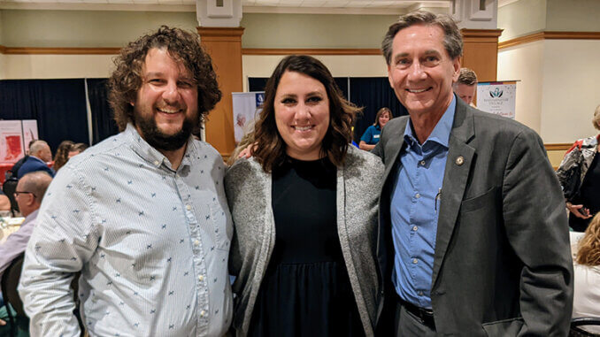 Mayor Ridenour is pictured with Alec and Carla Donahue, two of Muncie's most recent remote workers at a Muncie on the Move breakfast.