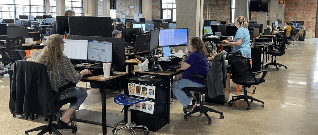 Accutech Systems Corp. employees at work in their office in the former Sears Building in downtown Muncie. The company’s flagship product is a trust accounting platform used by banks and wealth managers. Photo provided
