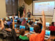 Ryan Hunter, co-founder of TechWise Academy, leads a Minecraft Party in which students get to learn about command blocks and play online in a safe environment. File photo.