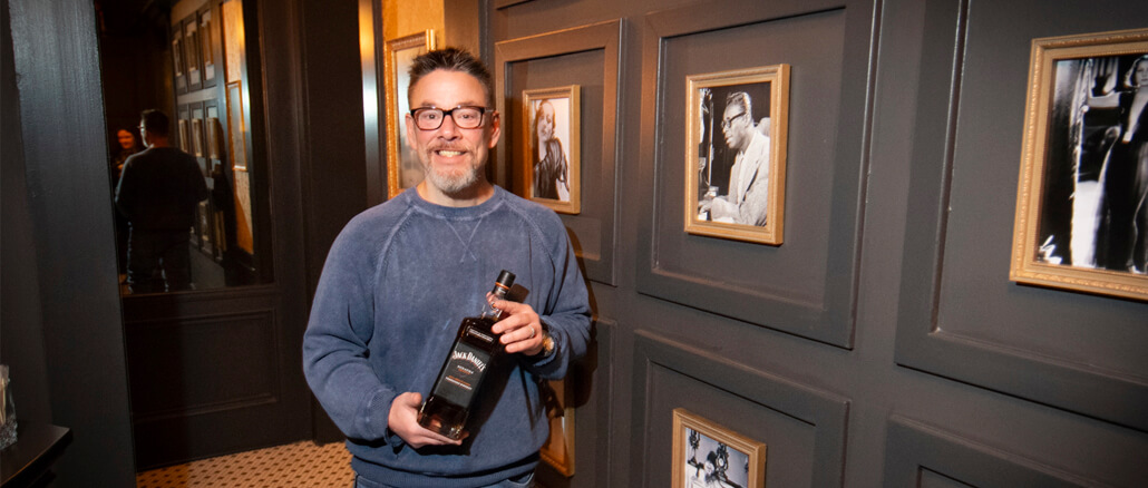 Mike Robinson is pictured holding a bottle of his special Jack Daniels Sinatra Select whiskey. Photo by Mike Rhodes