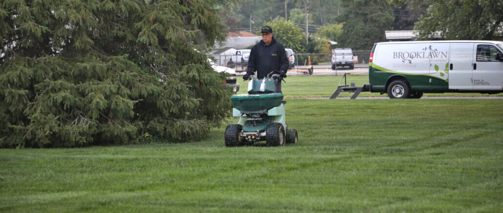 A Brooklawn Services team member performing lawn fertilization and weed control services in East Central Indiana. Photo provided