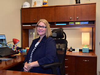 Traci Lutton, vice president of the Muncie-Delaware County Economic Development Alliance is pictured in her new office in the former Old National Bank building in downtown Muncie. Photo by Mike Rhodes